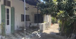 Casa antigua + local comercial